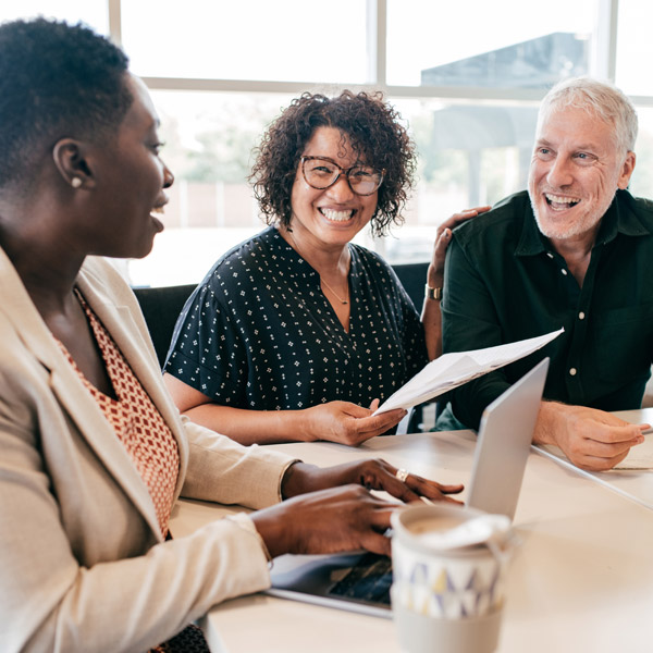three business people in a meeting