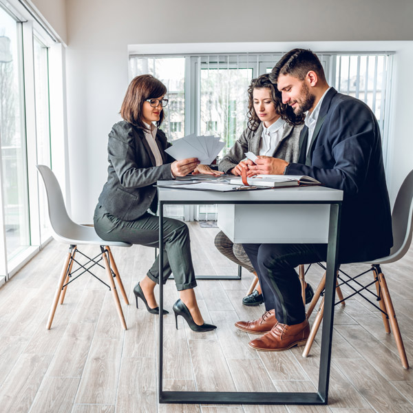 three business people in a meeting